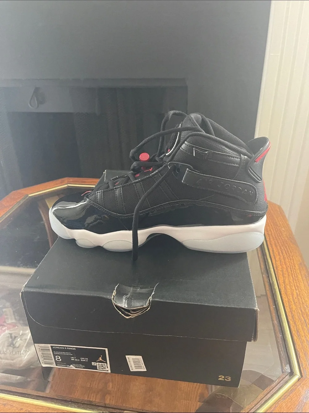 Jordan men’sHigh-Top Sneakers in Black with Red Accents